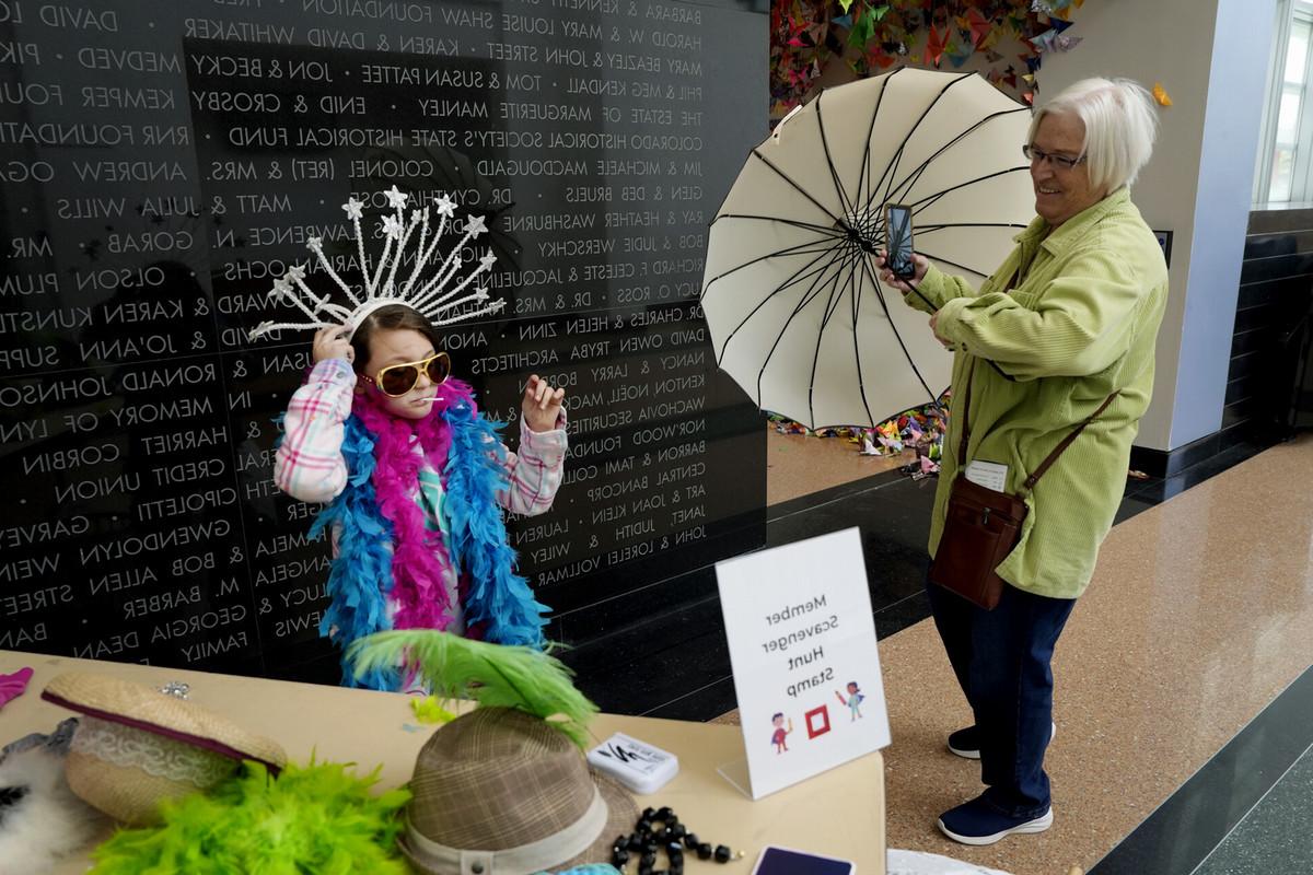 帕特收, 左, watches and assists her granddaughter, 凤凰赛克斯, 9, on May 11 during Family Adventure Day at the FAC. Children and adults alike watched puppetry, created art and played dress up, while walking through a variety of Bemis School of Art instructors’ booths and displays. Photo by Jamie Cotten / Colorado College